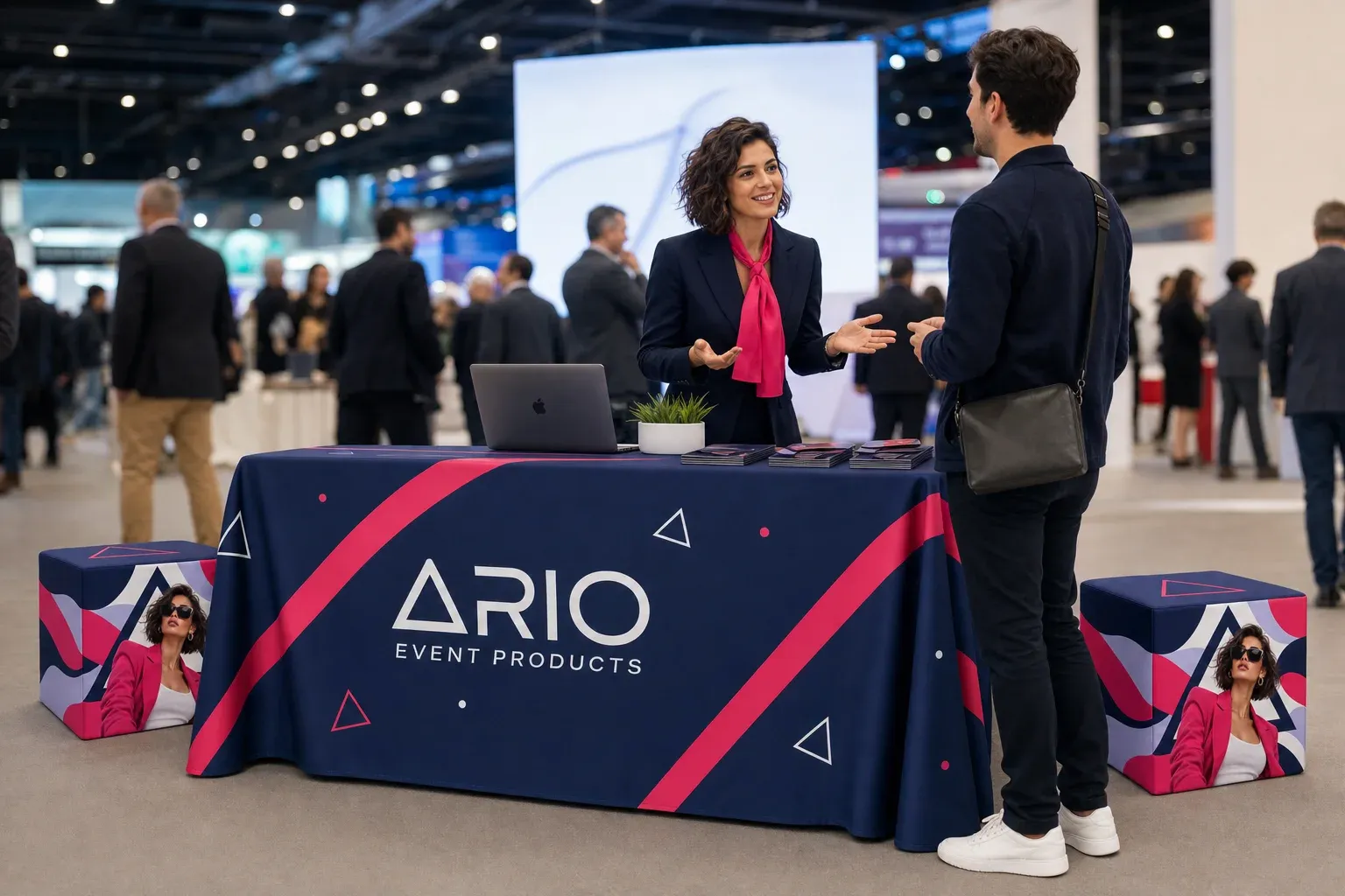 trade show stand with a table in an ARIO printed tablecloth