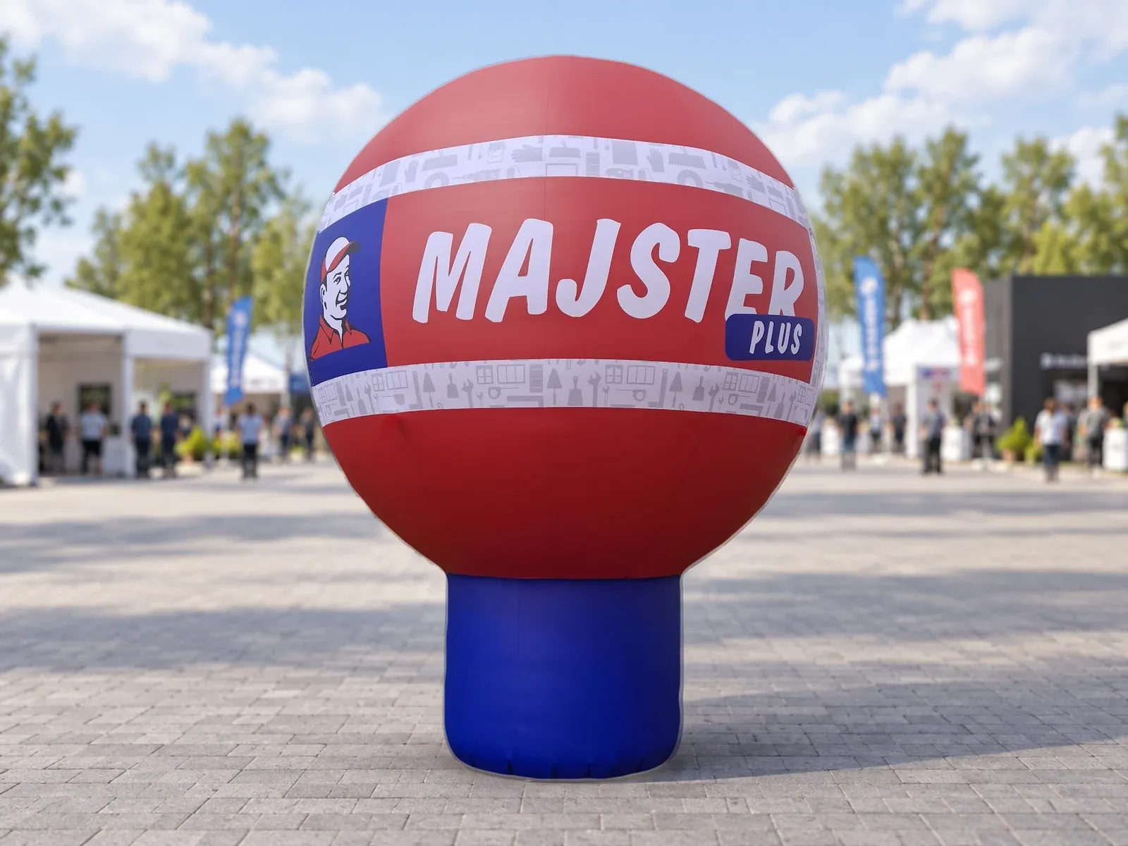 Balon reklamowy pneumatyczny z nadrukiem w barwach marki Majster Plus – produkt ARIO, tło wygenerowane przez AI